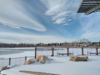 Scenic view of lake against sky during winter