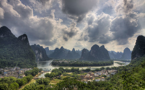 Panoramic view of landscape against cloudy sky