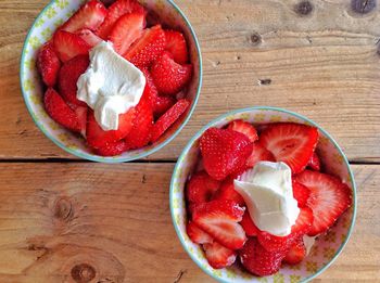 High angle view of strawberries in bowl on table