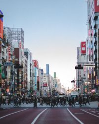 City street and buildings against sky