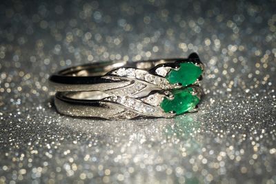 Close-up of wedding rings on table