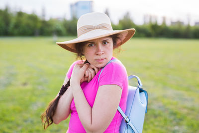 Portrait of woman with pink hat