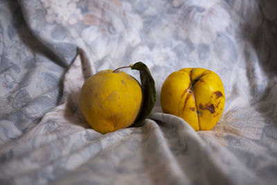 Close-up of yellow fruits on bed