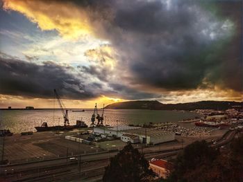 Panoramic view of sea against dramatic sky during sunset