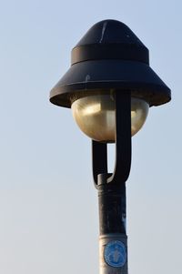 Low angle view of street light against sky