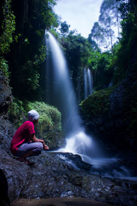 Scenic view of waterfall in forest