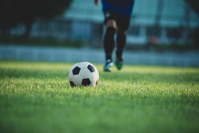 Low section of person on soccer field