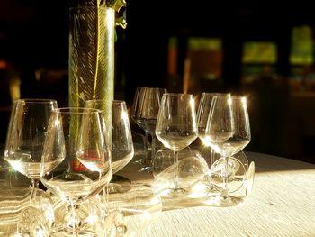 Close-up of wine glasses on table