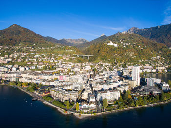 Aerial view of river amidst buildings in city