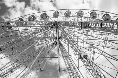 Low angle view of ferris wheel against sky