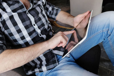 High angle view of man holding hands