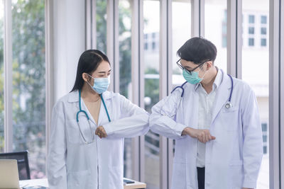 Young couple standing in corridor