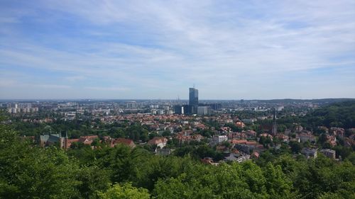 High angle view of trees and buildings against sky