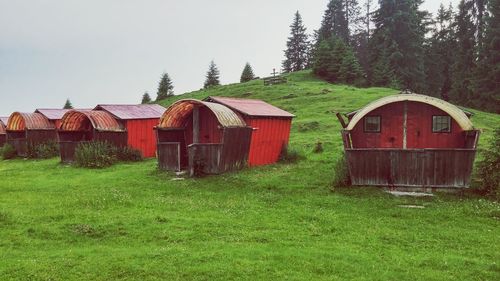 Built structure on field against sky