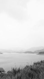 Scenic shot of calm lake against mountain range