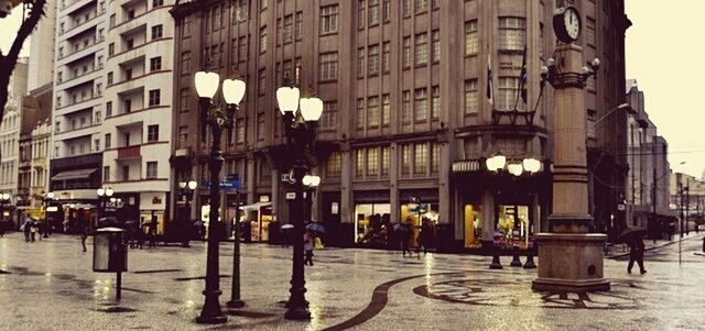 building exterior, architecture, built structure, city, street, large group of people, city life, person, walking, building, men, road, city street, street light, lifestyles, outdoors, transportation, sidewalk, group of people