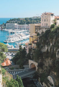 View of town by sea against clear sky