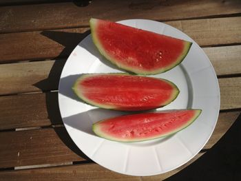 High angle view of fruits in plate on table