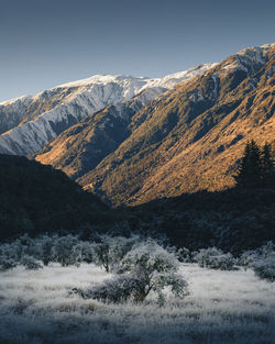 Scenic view of snowcapped mountains against clear sky