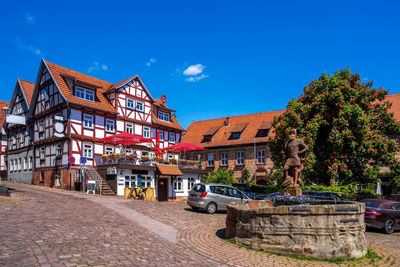 View of buildings against blue sky