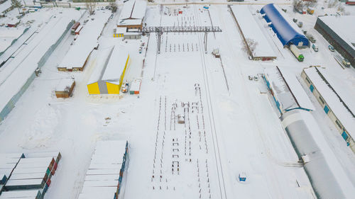 High angle view of snow covered airplane