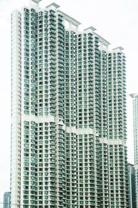 Low angle view of modern building against sky in city