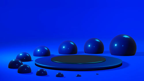 Close-up of multi colored balls against blue background