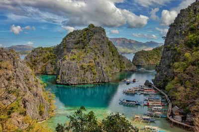 High angle view of boats in sea against sky
