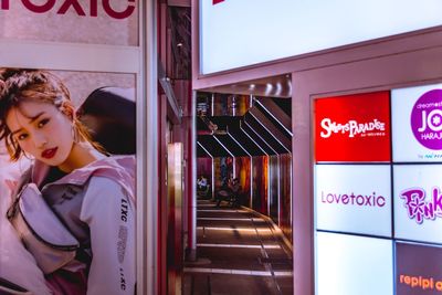 Woman standing in illuminated store