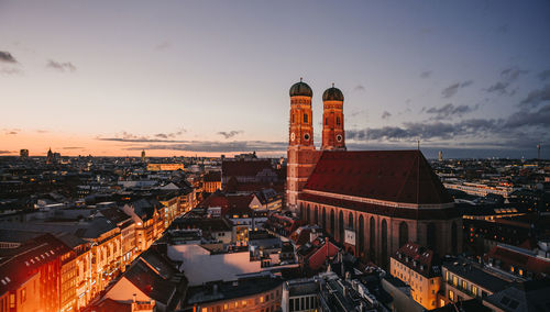 High angle view of buildings in city against sky during sunset