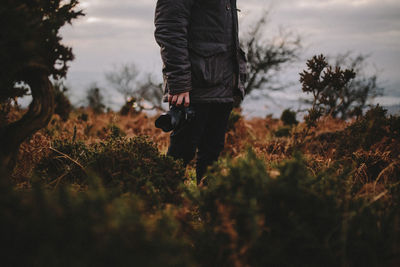 Low section of man on tree