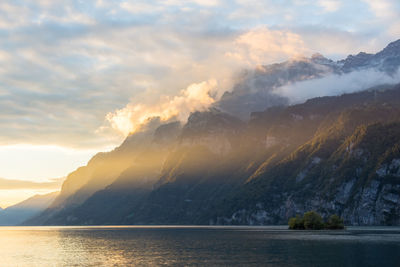 Scenic view of mountains against sky during sunset