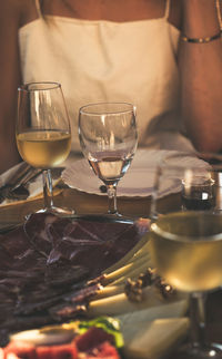 Close-up of wine glasses on table