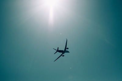 Low angle view of airplane flying in sky