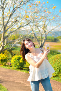 Young woman holding flower