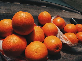 High angle view of oranges in container