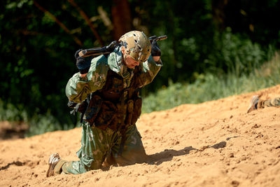Rear view of man standing on field