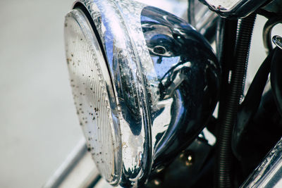 Close-up of motorcycle headlight