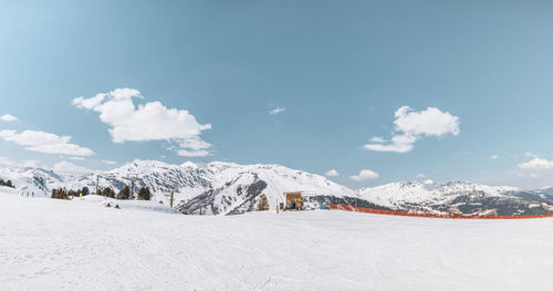 Scenic view of snowcapped mountains against sky