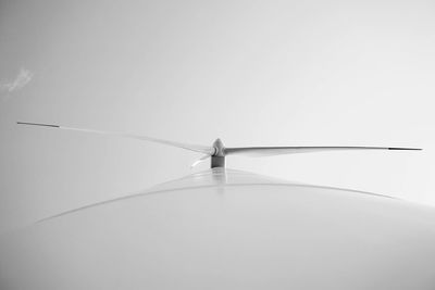Low angle view of birds against clear sky