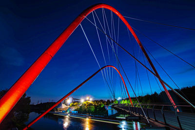 Low angle view of suspension bridge over river