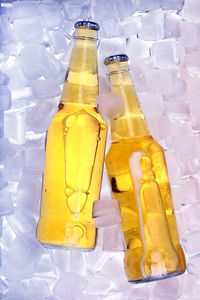 High angle view of yellow bottle on ice