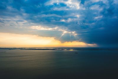 Scenic view of sea against sky at sunset