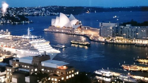 Illuminated city at waterfront