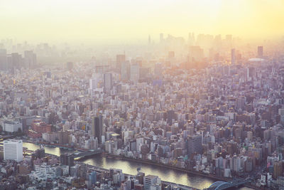 High angle view of modern buildings in city against sky