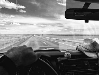 Car moving on road seen through windshield