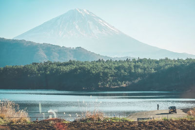 Scenic view of lake against mountain range