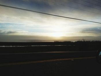 Scenic view of landscape against sky during sunset