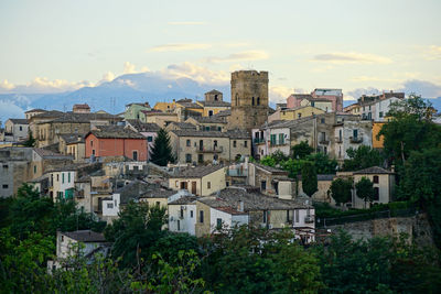 Houses in city against sky