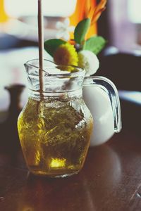 Close-up of drink in glass jar on table